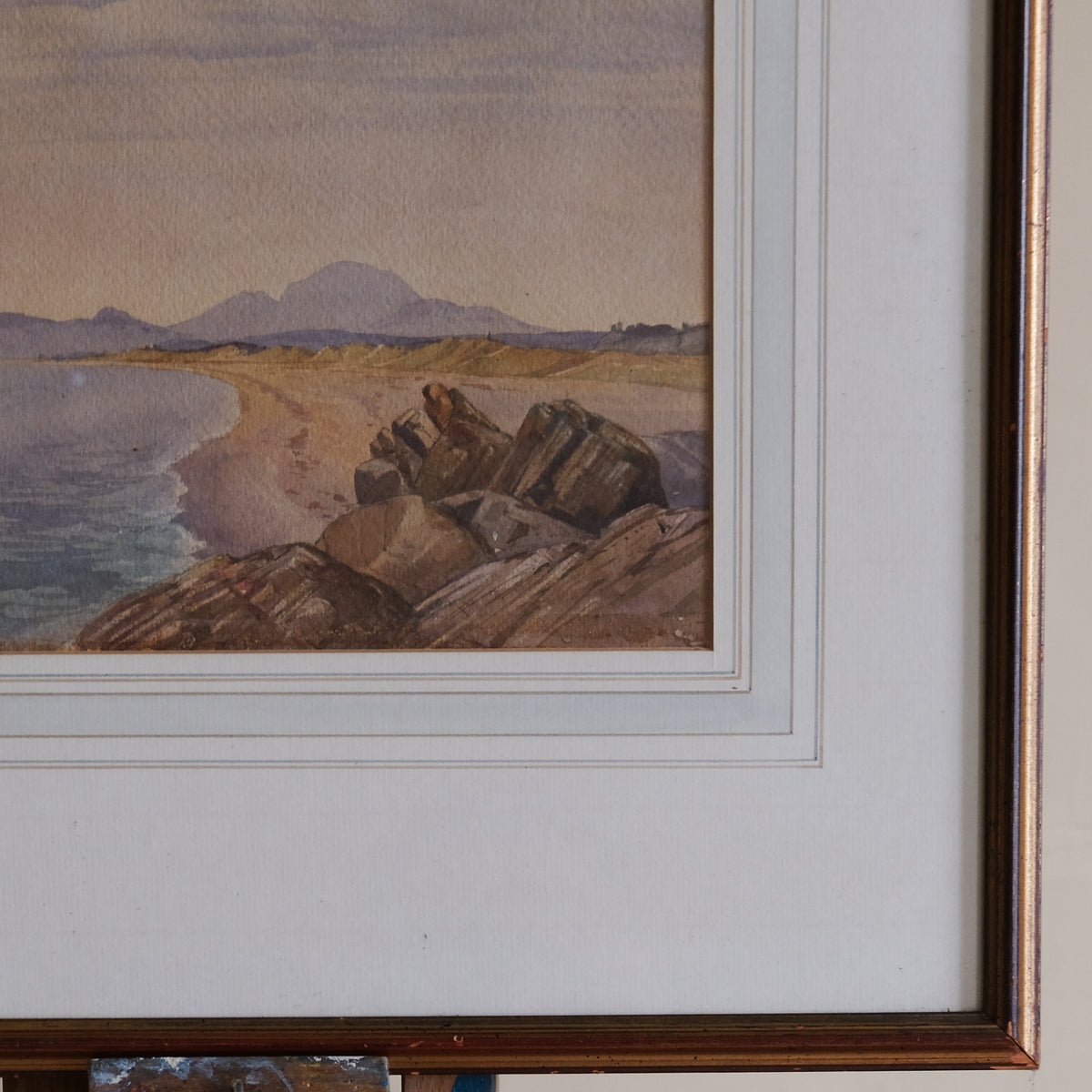 COASTAL LANDSCAPE WITH MOUNTAINS IN THE DISTANCE