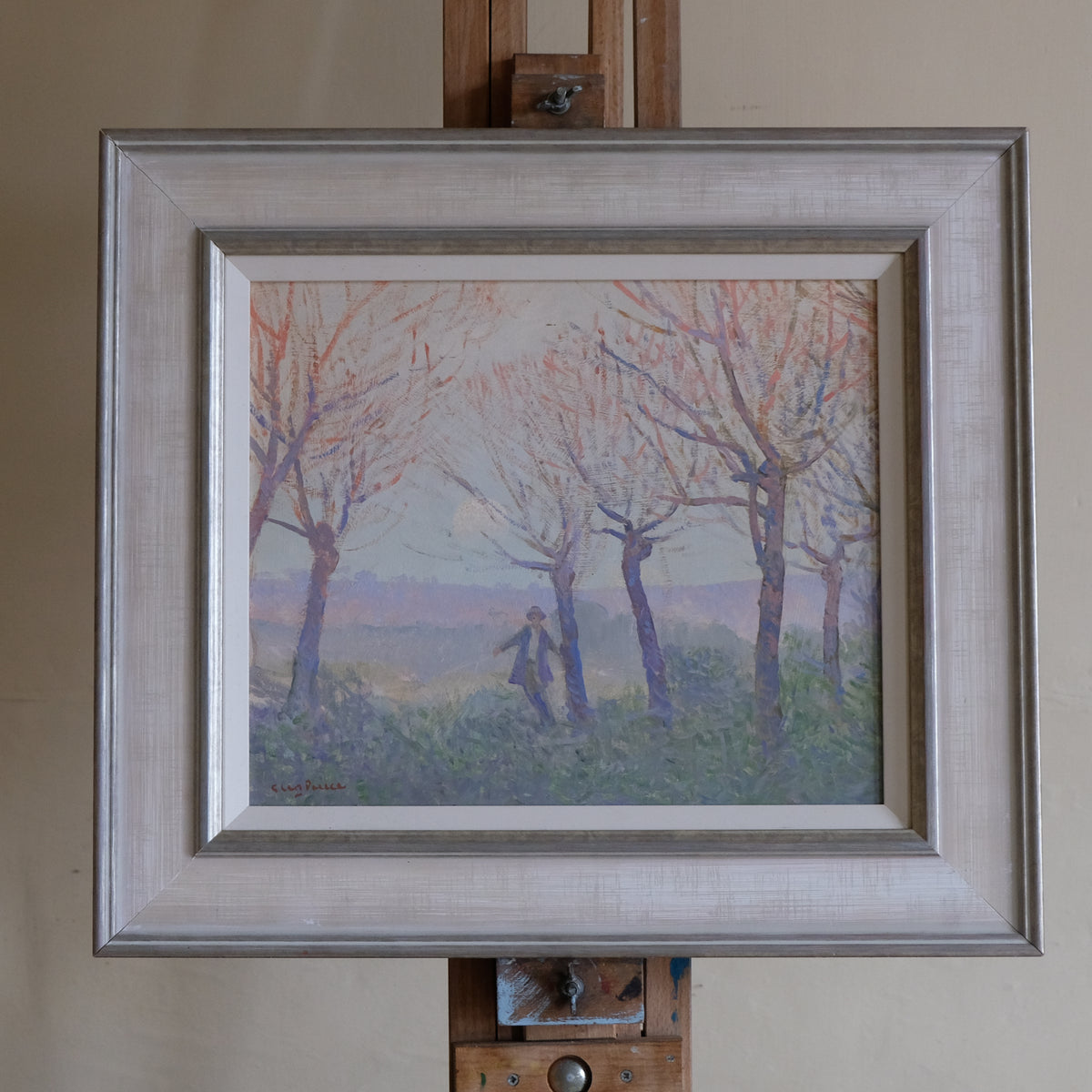 Framed painting, Glen Preece, of a landscape with trees and a person on an easel.
