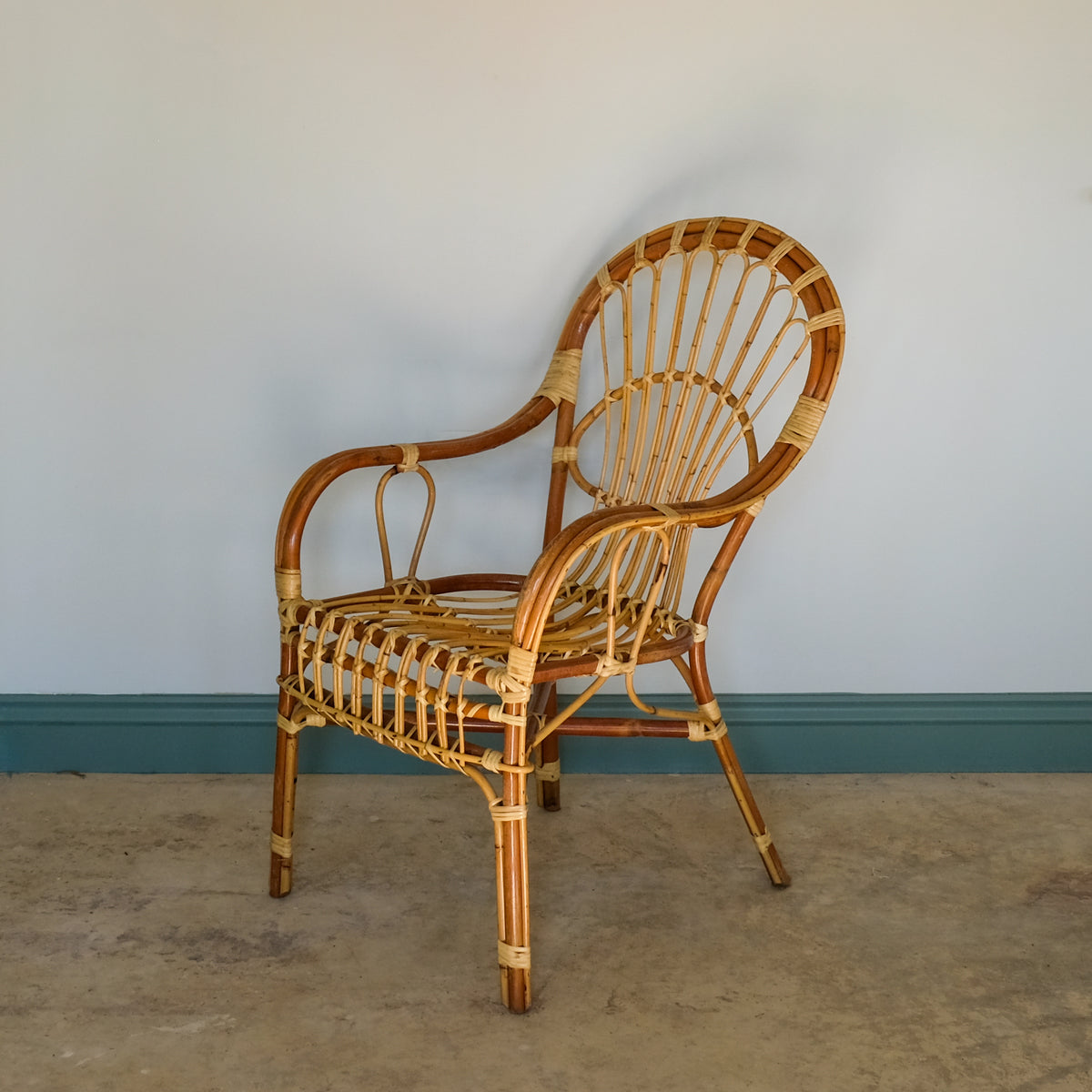 MID CENTURY RATTAN ARMCHAIR
