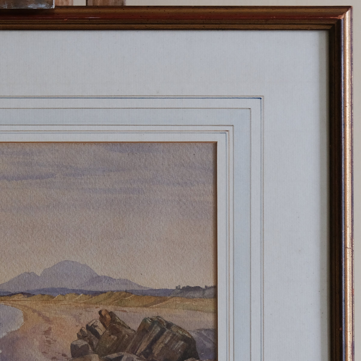 COASTAL LANDSCAPE WITH MOUNTAINS IN THE DISTANCE