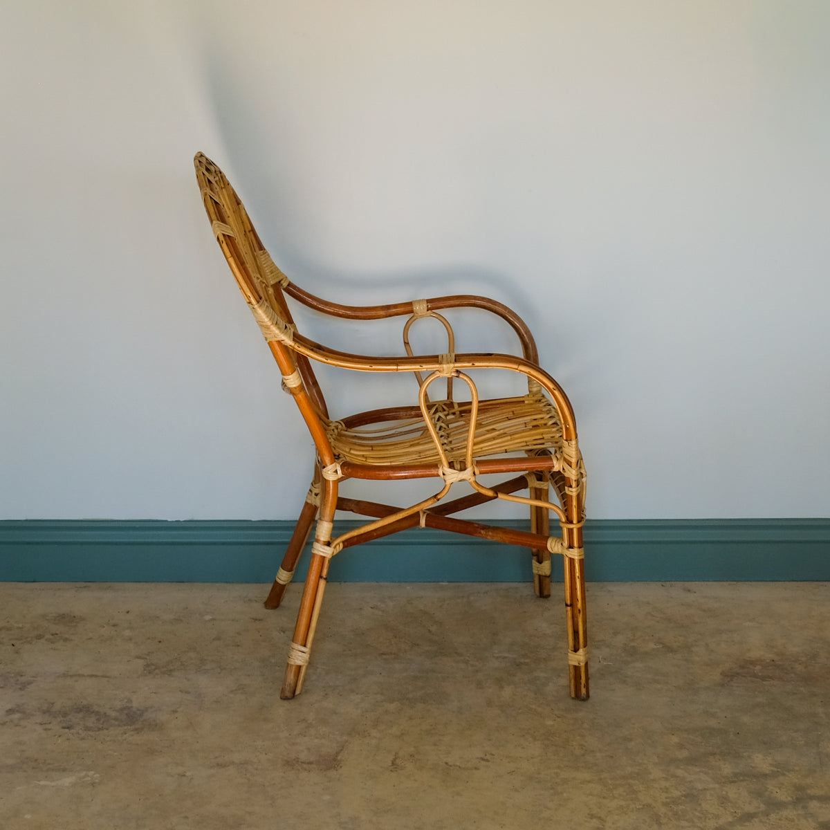 MID CENTURY RATTAN ARMCHAIR